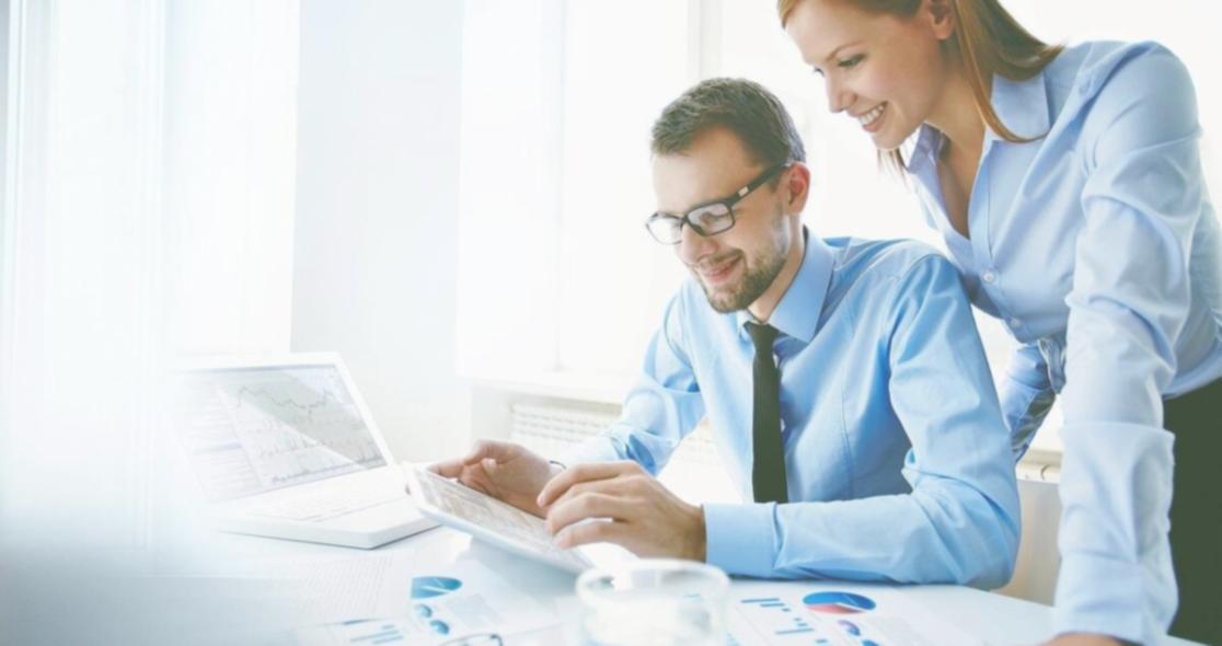 Team member reviewing student inquiries at desk
